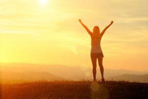 Woman with arms wide open and empowered in the sunset | codependency recovery in Florida | Codependency Treatment | online therapy in Florida | Counseling Solutions of Broward 33023