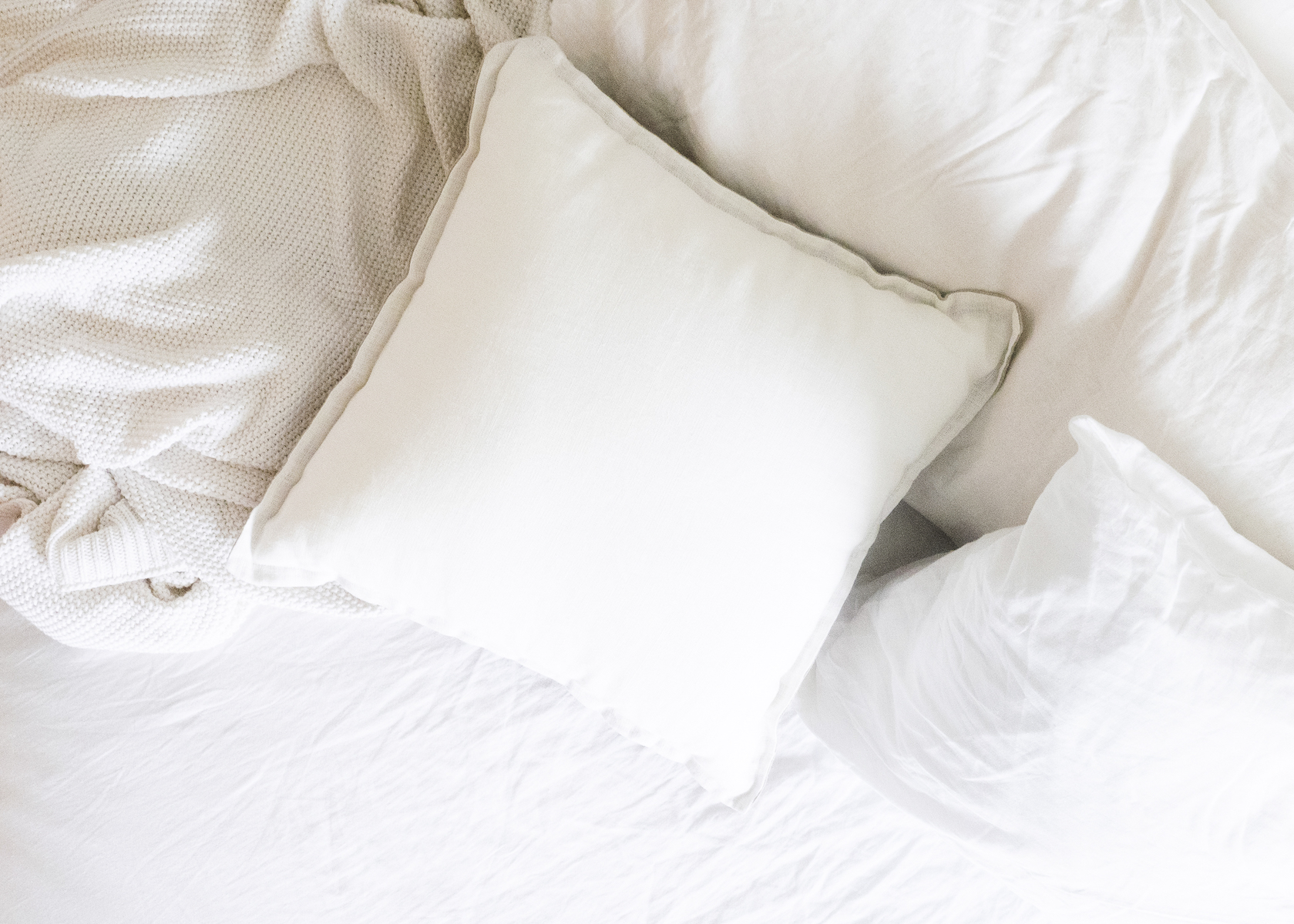 Close up of pillow on bed with white linens. Talk to a Florida therapist for codependency treatment in Miramar, FL via online therapy in Florida.